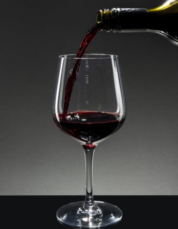 Red wine pouring into a wine glass