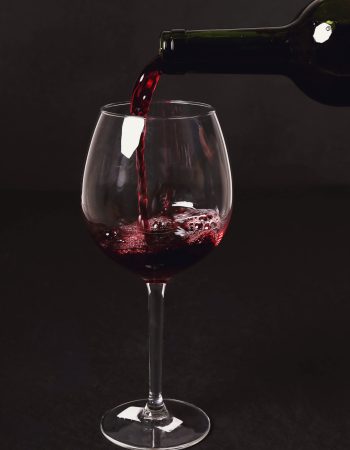 Alcoholic drink. Red wine pouring